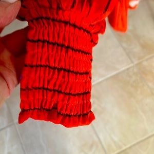 Blouse with bright floral contemporary colors- orange, green, black, purple.